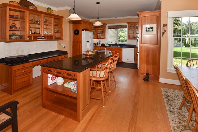 16 Brookfield Dr, Ellington, CT 06029 - kitchen featuring open shelves, white appliances, brown cabinets, light wood-type flooring, and decorative backsplash