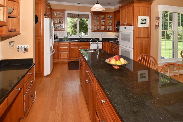 16 Brookfield Dr, Ellington, CT 06029 - kitchen with white appliances, brown cabinetry, light wood finished floors, and ornamental molding