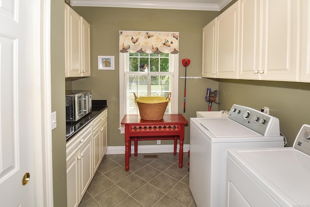 16 Brookfield Dr, Ellington, CT 06029 - laundry area with washing machine and dryer, cabinet space, tile patterned floors, and ornamental molding