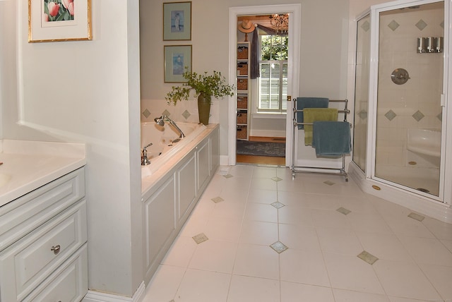 16 Brookfield Dr, Ellington, CT 06029 - full bath featuring a stall shower, a garden tub, vanity, and tile patterned flooring
