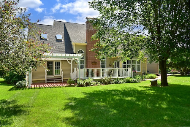 16 Brookfield Dr, Ellington, CT 06029 - rear view of property featuring a pergola, a lawn, a deck, a shingled roof, and a chimney