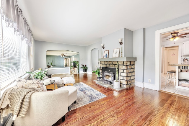 64 Mohawk Ave, Derby, CT 06418 - living area with ceiling fan, arched walkways, wood finished floors, and a fireplace