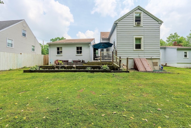 64 Mohawk Ave, Derby, CT 06418 - rear view of property featuring a wooden deck and a vegetable garden