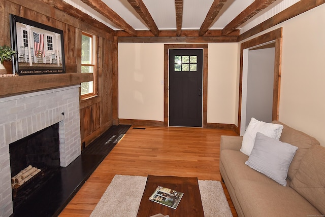 20 Battle St, Somers, CT 06071 - unfurnished living room featuring beamed ceiling, light wood-type flooring, and a fireplace
