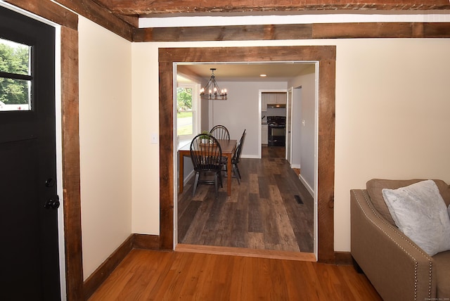 20 Battle St, Somers, CT 06071 - corridor featuring wood finished floors, a chandelier, and beam ceiling