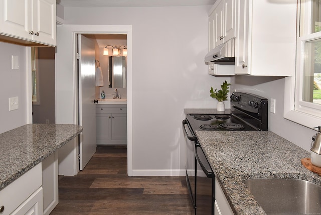 20 Battle St, Somers, CT 06071 - kitchen featuring electric range, dark wood-style floors, under cabinet range hood, white cabinetry, and dark stone counters