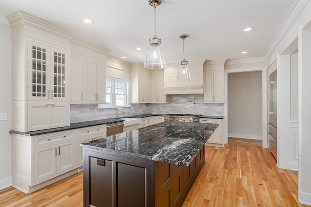 19 Ives Ct, Ridgefield, CT 06877 - kitchen with light wood-style flooring, glass insert cabinets, backsplash, white cabinets, and crown molding