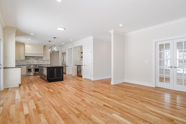 19 Ives Ct, Ridgefield, CT 06877 - kitchen with double oven range, tasteful backsplash, beverage cooler, a center island, and ornamental molding