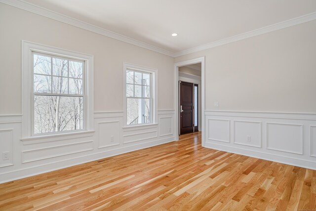 19 Ives Ct, Ridgefield, CT 06877 - spare room with light wood-type flooring, ornamental molding, a wainscoted wall, a decorative wall, and recessed lighting