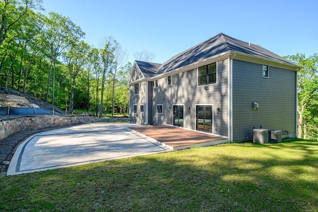 19 Ives Ct, Ridgefield, CT 06877 - rear view of house with a yard and a patio