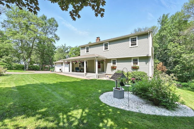 247 Mountain View Rd, Somers, CT 06071 - rear view of property with a garage, a lawn, and a chimney