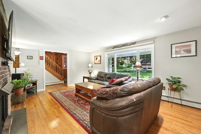 247 Mountain View Rd, Somers, CT 06071 - living area with baseboard heating, stairway, and light wood-style flooring