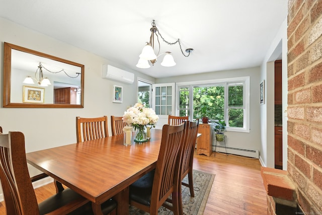 247 Mountain View Rd, Somers, CT 06071 - dining area with a chandelier, a baseboard radiator, a wall mounted AC, and light wood-style floors