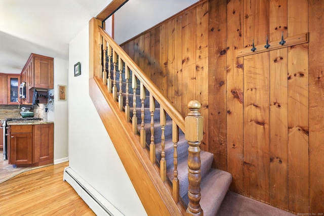247 Mountain View Rd, Somers, CT 06071 - stairway featuring a baseboard radiator and wood finished floors