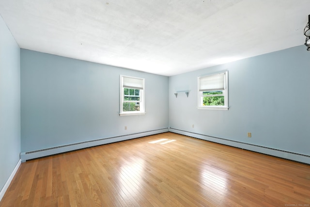 247 Mountain View Rd, Somers, CT 06071 - spare room featuring plenty of natural light, wood finished floors, and baseboard heating