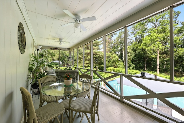247 Mountain View Rd, Somers, CT 06071 - sunroom / solarium with a ceiling fan, outdoor dining area, and view of wooded area