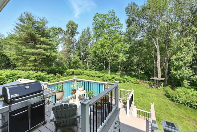 247 Mountain View Rd, Somers, CT 06071 - deck with a yard, view of wooded area, and grilling area