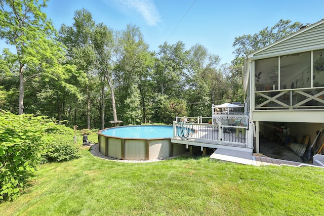 247 Mountain View Rd, Somers, CT 06071 - outdoor pool with a sunroom, a wooden deck, a lawn, and view of scattered trees