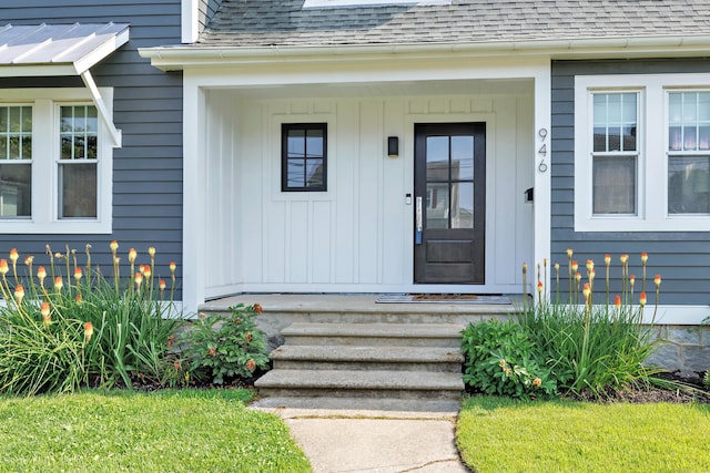 946 Wilcoxson Ave, Stratford, CT 06614 - view of exterior entry with a shingled roof and board and batten siding