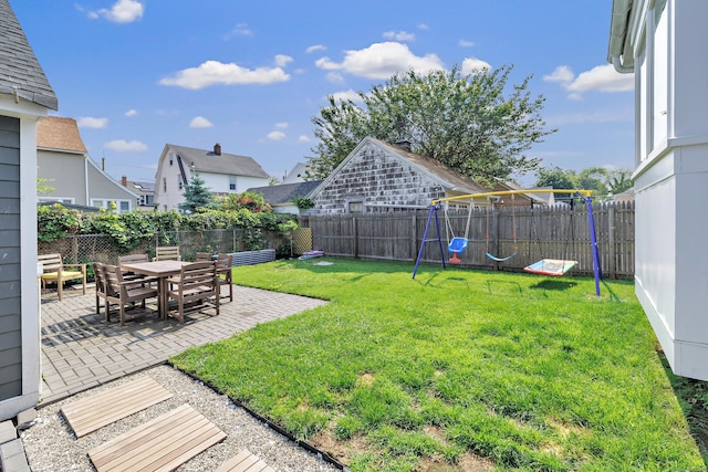 946 Wilcoxson Ave, Stratford, CT 06614 - fenced backyard with a patio area and a playground