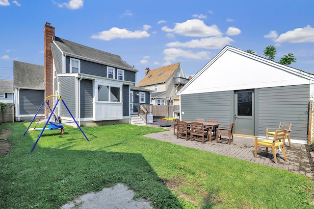 946 Wilcoxson Ave, Stratford, CT 06614 - rear view of house featuring a patio, a chimney, and entry steps