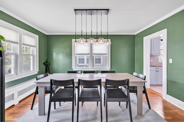946 Wilcoxson Ave, Stratford, CT 06614 - dining space featuring wood finished floors and crown molding