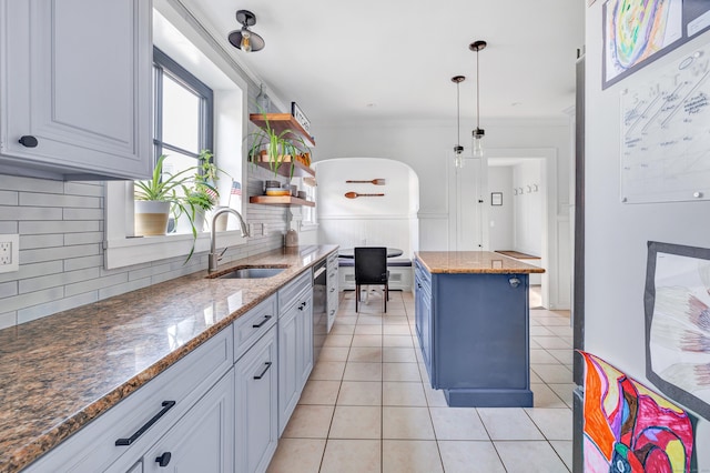 946 Wilcoxson Ave, Stratford, CT 06614 - kitchen with open shelves, tasteful backsplash, light tile patterned flooring, ornamental molding, and stainless steel dishwasher