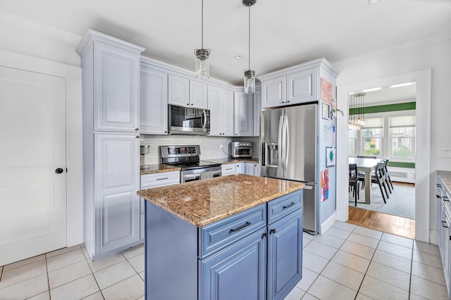 946 Wilcoxson Ave, Stratford, CT 06614 - kitchen with appliances with stainless steel finishes, light tile patterned floors, backsplash, light stone counters, and hanging light fixtures