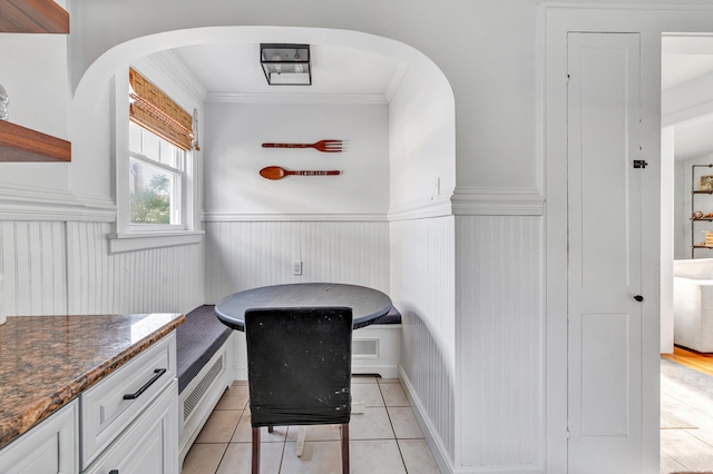 946 Wilcoxson Ave, Stratford, CT 06614 - office with wainscoting, arched walkways, light tile patterned flooring, and ornamental molding