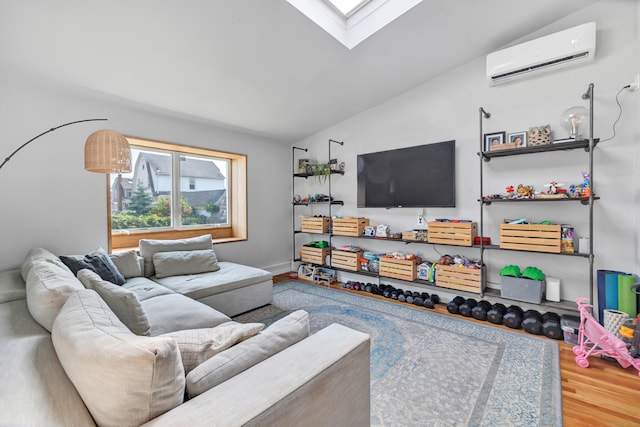 946 Wilcoxson Ave, Stratford, CT 06614 - living area featuring a wall mounted AC, wood finished floors, vaulted ceiling, and a skylight