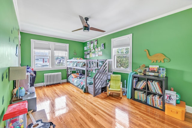 946 Wilcoxson Ave, Stratford, CT 06614 - bedroom featuring radiator heating unit, wood finished floors, ornamental molding, and ceiling fan