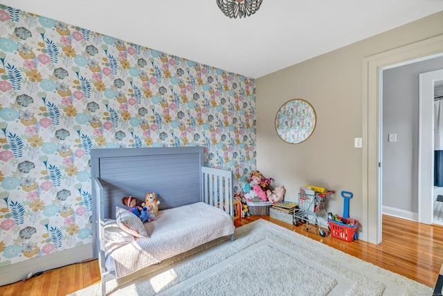 946 Wilcoxson Ave, Stratford, CT 06614 - bedroom featuring wallpapered walls and wood finished floors