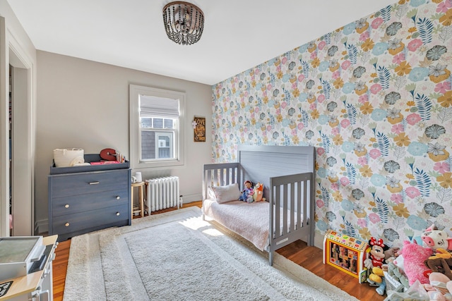 946 Wilcoxson Ave, Stratford, CT 06614 - bedroom with radiator heating unit and wood finished floors
