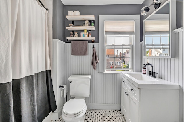 946 Wilcoxson Ave, Stratford, CT 06614 - bathroom with wainscoting, vanity, and a shower with shower curtain