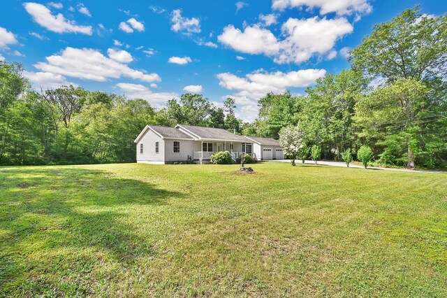 125 E Old Route 6, Hampton, CT 06247 - view of grassy yard with a garage and driveway