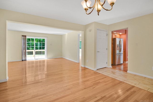 125 E Old Route 6, Hampton, CT 06247 - spare room with a chandelier and light wood-style flooring