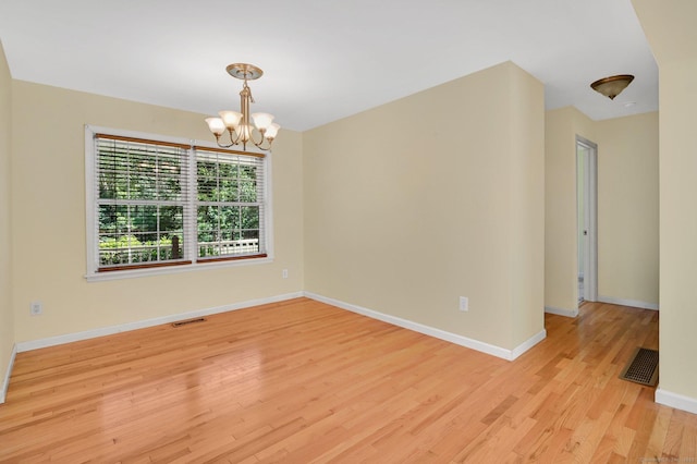 125 E Old Route 6, Hampton, CT 06247 - spare room featuring light wood-style floors and a chandelier