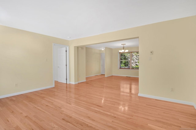 125 E Old Route 6, Hampton, CT 06247 - spare room featuring a chandelier and light wood-style flooring