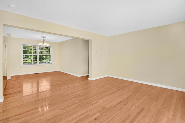125 E Old Route 6, Hampton, CT 06247 - unfurnished room with a chandelier, light wood finished floors, and a smoke detector