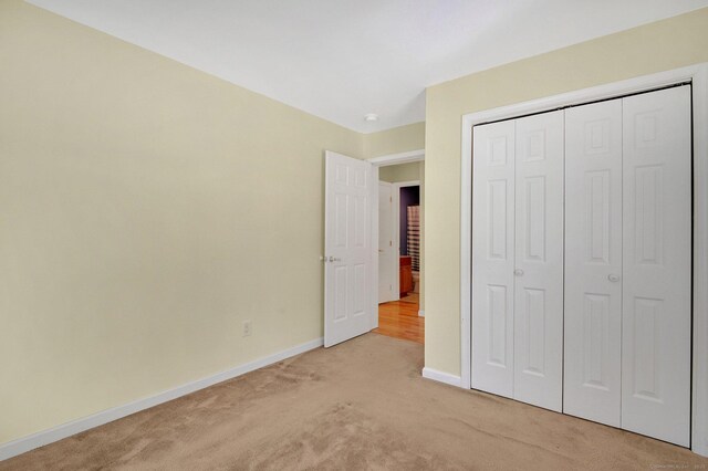 125 E Old Route 6, Hampton, CT 06247 - unfurnished bedroom with light carpet and a closet
