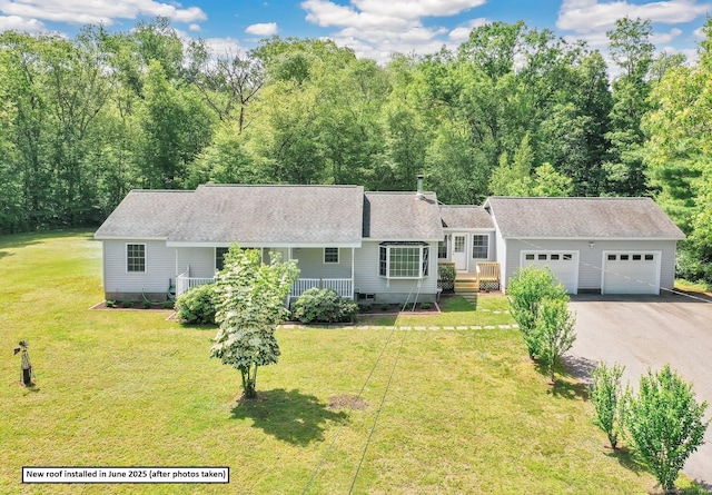 125 E Old Route 6, Hampton, CT 06247 - view of front facade featuring a garage, asphalt driveway, roof with shingles, a front lawn, and a porch