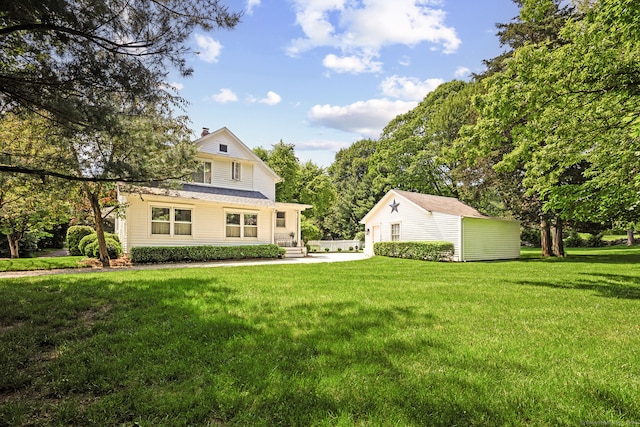 7 Morningside Ln, Westport, CT 06880 - view of front of home featuring an outdoor structure, a front yard, and a chimney