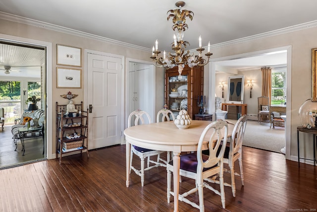 7 Morningside Ln, Westport, CT 06880 - dining room with dark wood-style flooring, a chandelier, and crown molding