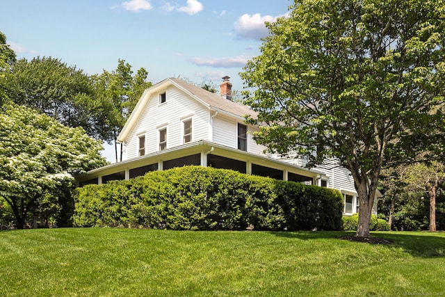 7 Morningside Ln, Westport, CT 06880 - view of front of house with a chimney, a front yard, and a sunroom