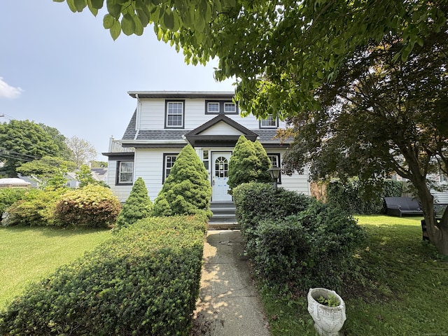 5 Lindsley Pl, Stratford, CT 06615 - view of front facade featuring a front lawn and a shingled roof