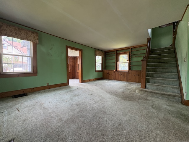 5 Lindsley Pl, Stratford, CT 06615 - unfurnished living room featuring stairs and carpet