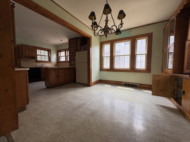 5 Lindsley Pl, Stratford, CT 06615 - unfurnished dining area featuring a chandelier and baseboards