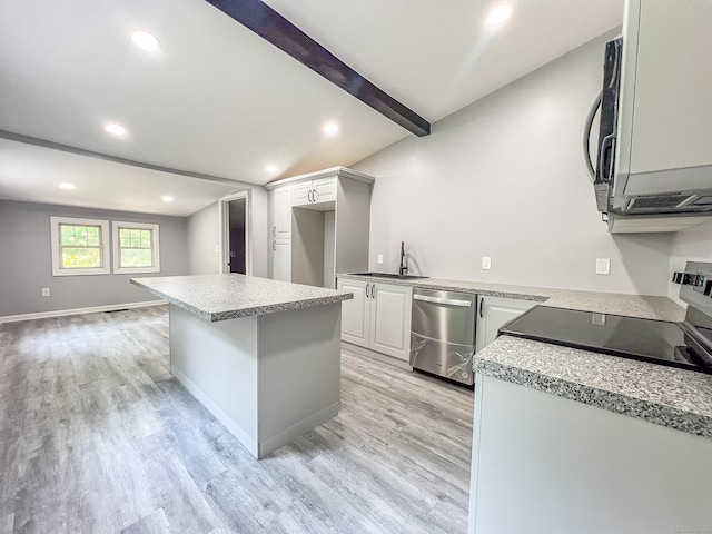 45 Cedar Ave, Wolcott, CT 06716 - kitchen with stainless steel dishwasher, light wood-style floors, a kitchen island, recessed lighting, and light countertops