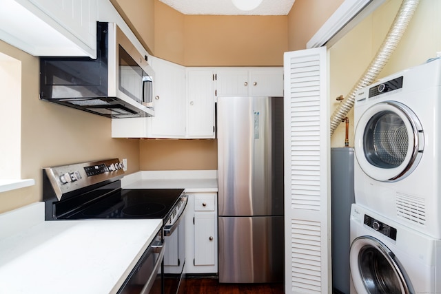 118 Washington St # U304, Norwalk, CT 06854 - laundry room with stacked washer / drying machine