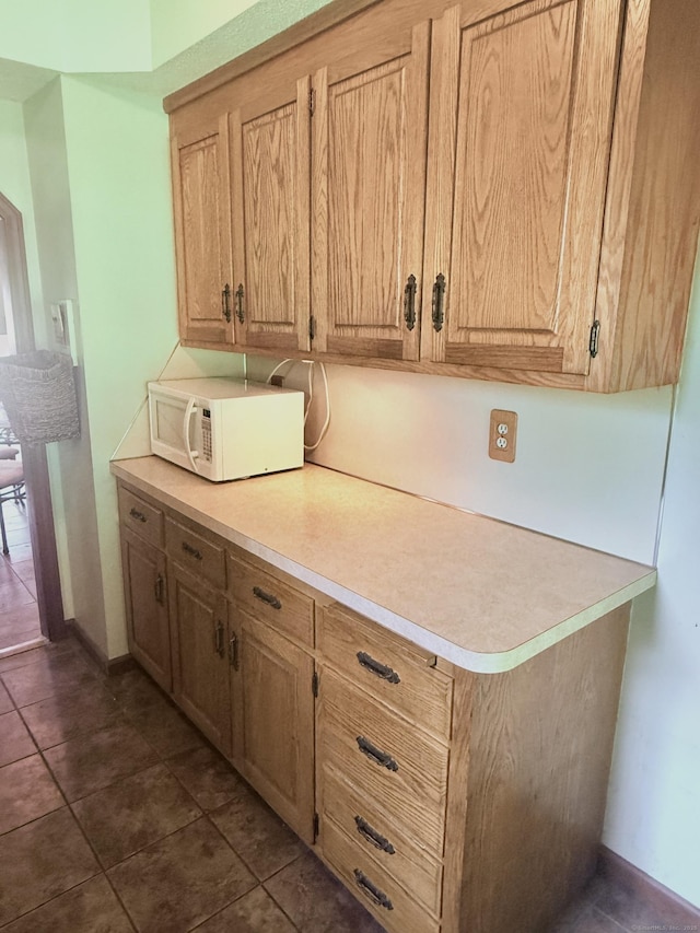 2 Walnut St, Plymouth, CT 06786 - kitchen featuring white microwave, light countertops, and dark tile patterned flooring